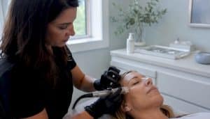 Clinician performing non-surgical eyelid treatment