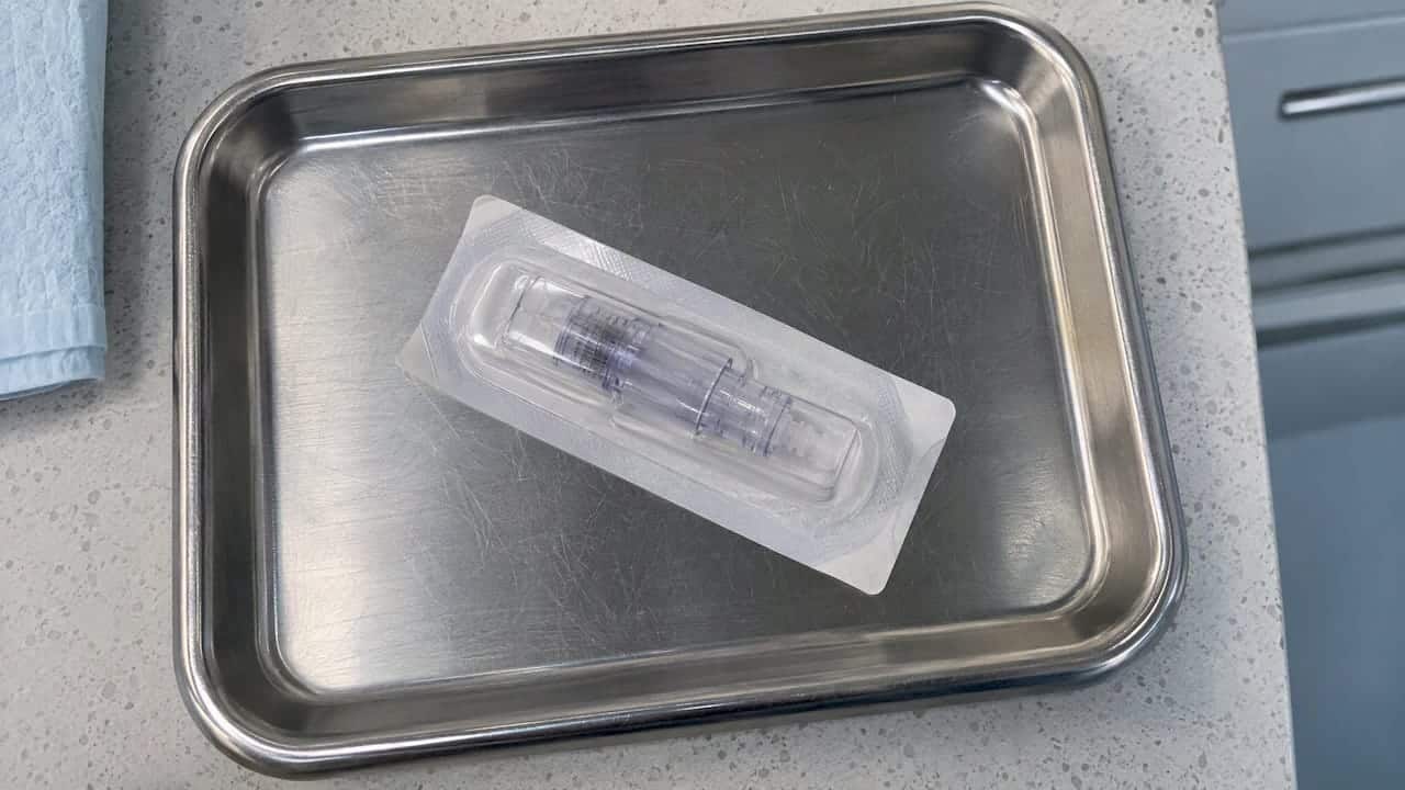 Sealed single-use microneedling cartridge on tray